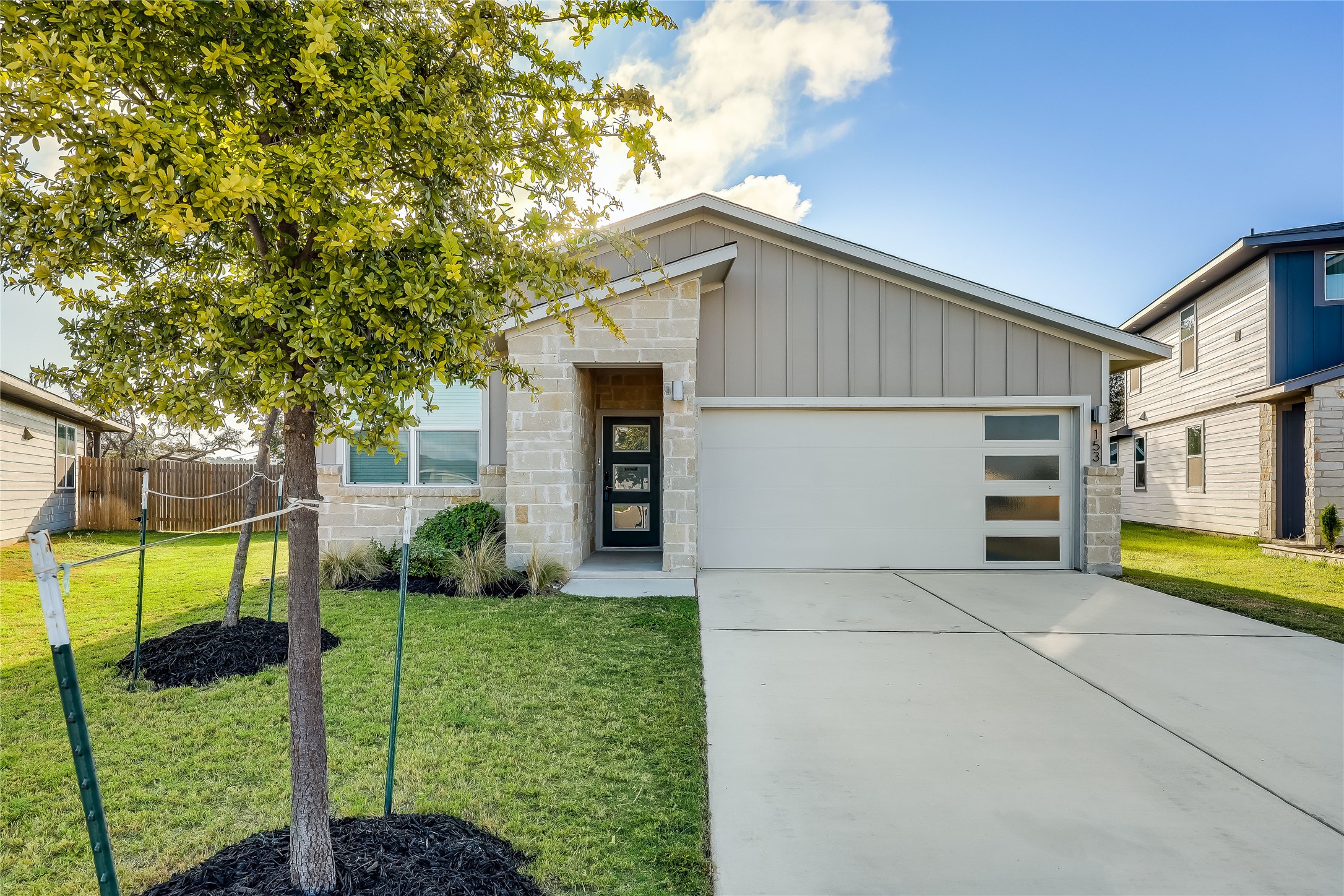153 Filifera Court Leander, TX 78641 - Photo 1 of 33 a view of a house with a yard and potted plants