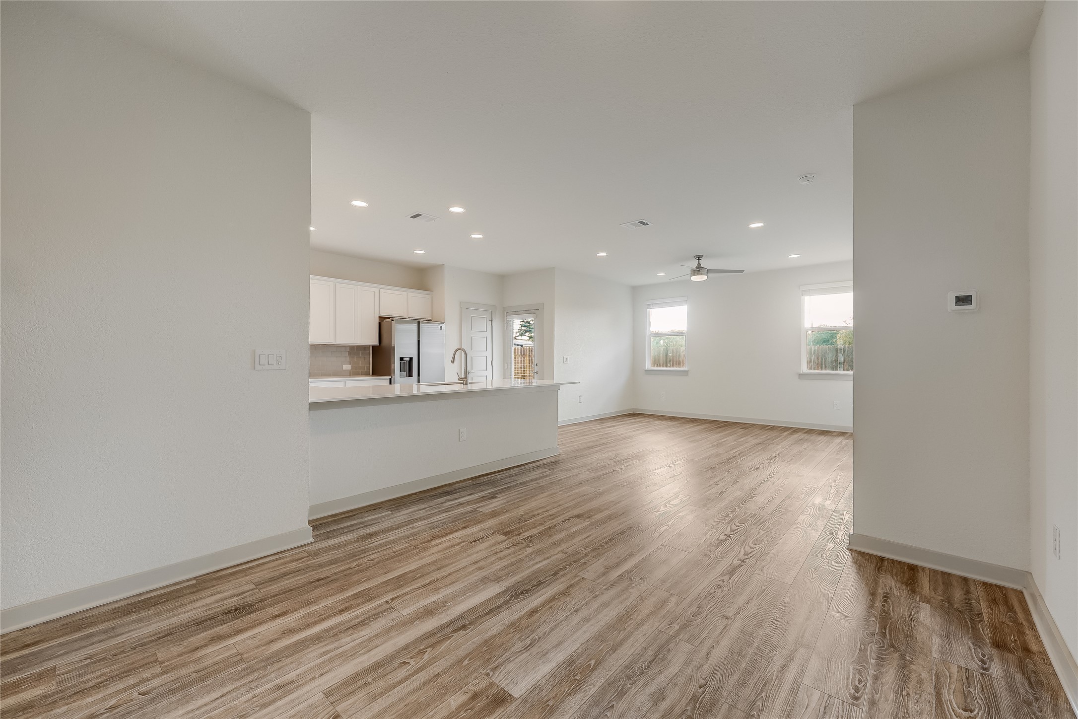 153 Filifera Court Leander, TX 78641 - Photo 11 of 33 a view of empty room with wooden floor