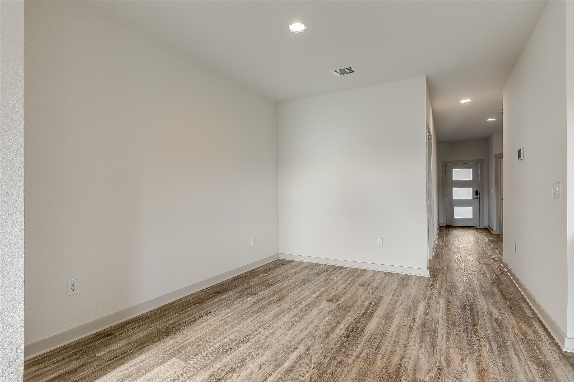 153 Filifera Court Leander, TX 78641 - Photo 13 of 33 a view of a room with wooden floor and brick walls