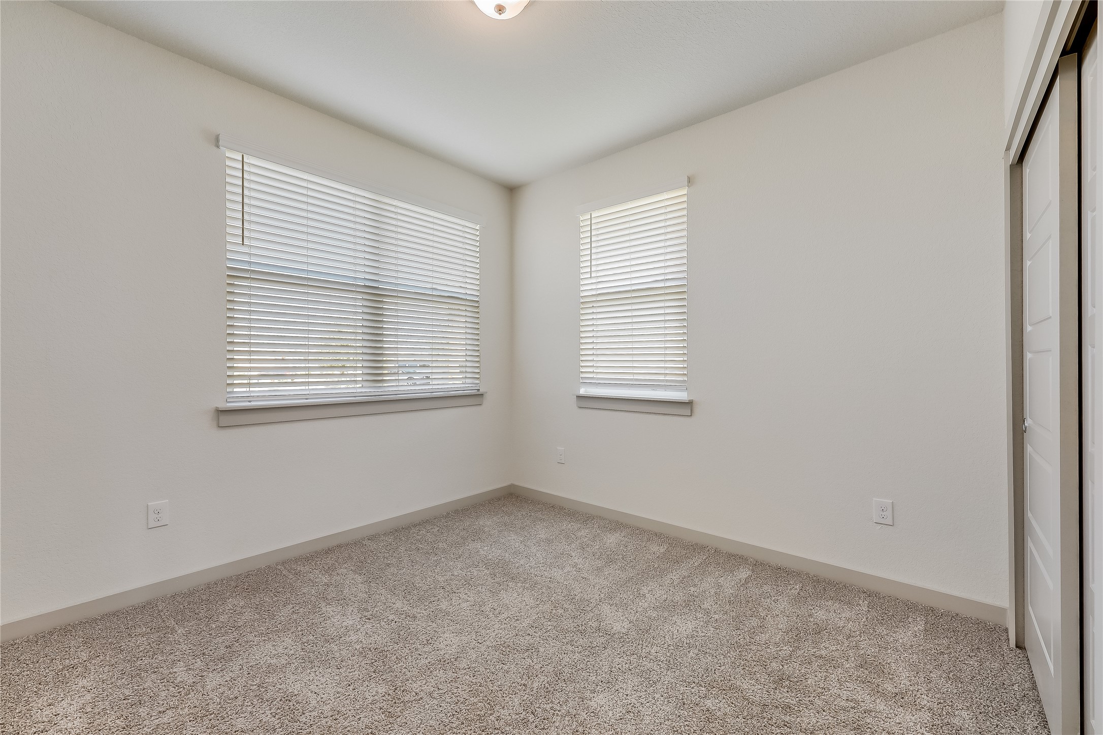 153 Filifera Court Leander, TX 78641 - Photo 14 of 33 an empty room with windows