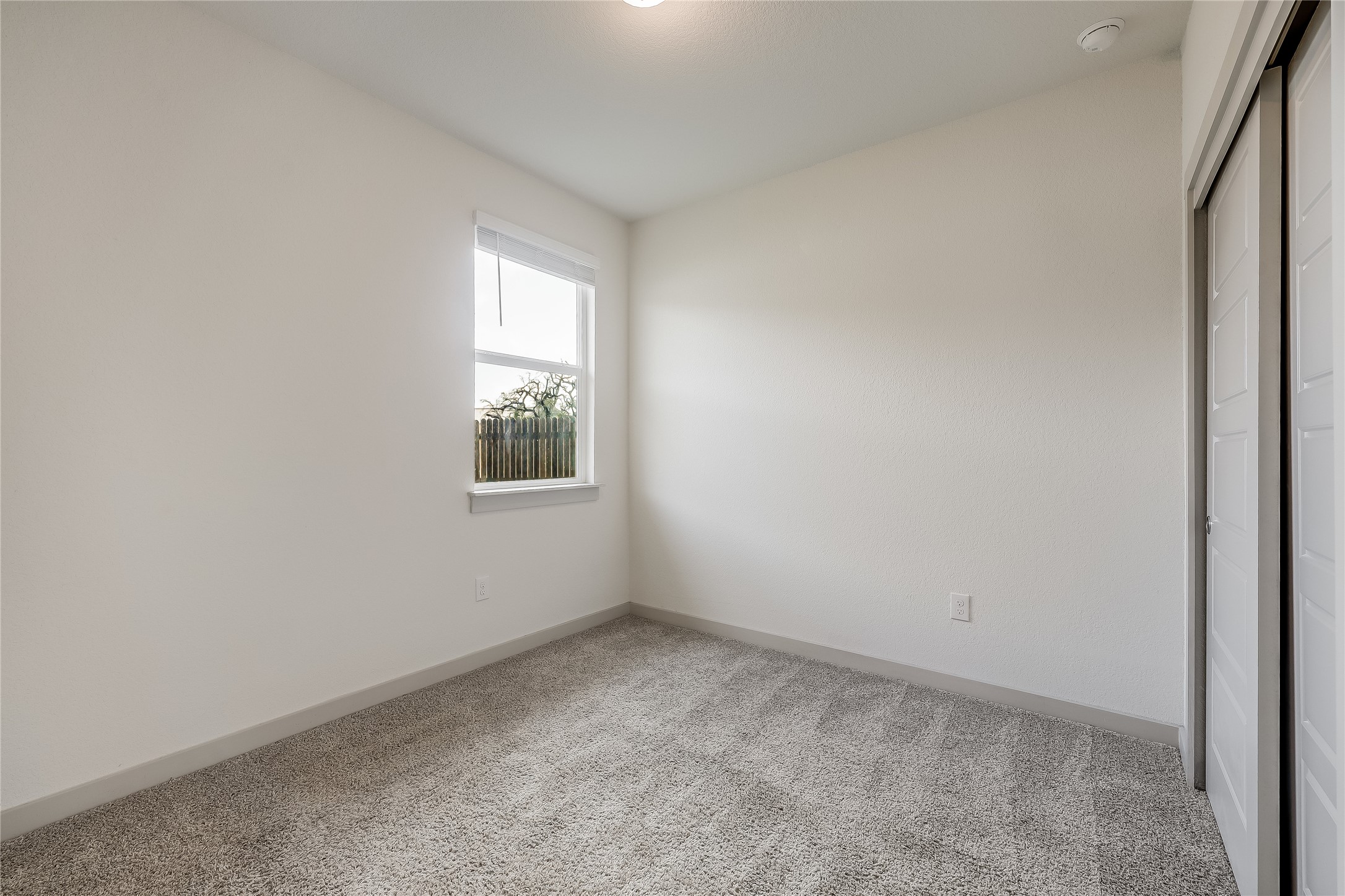 153 Filifera Court Leander, TX 78641 - Photo 15 of 33 an empty room with a window