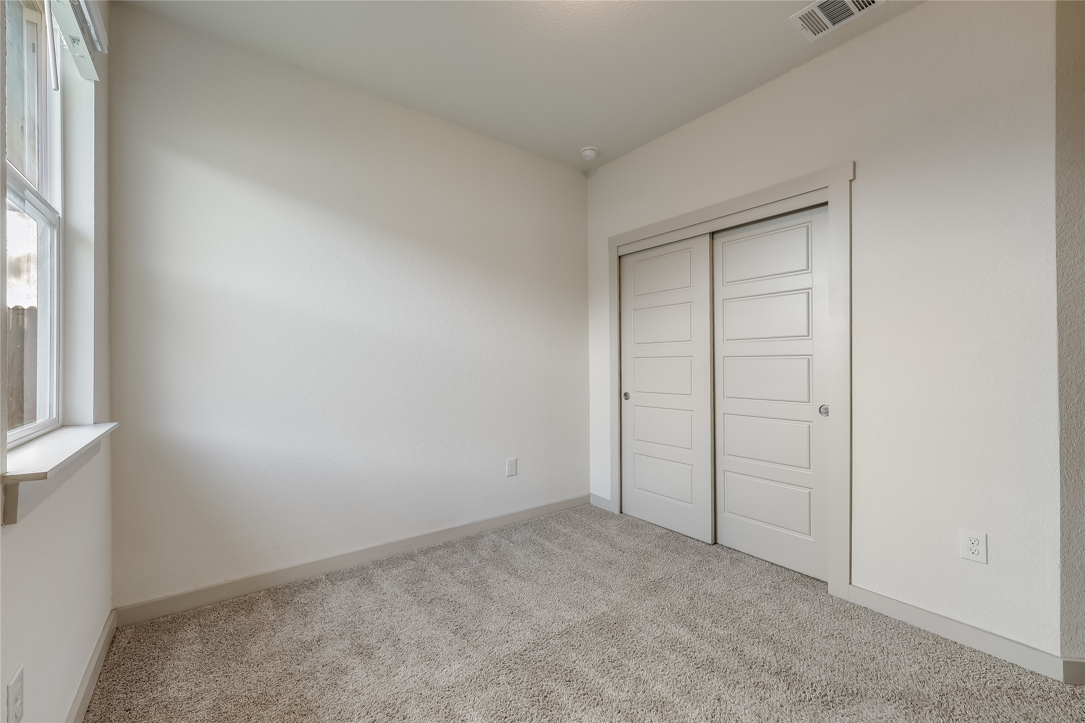 153 Filifera Court Leander, TX 78641 - Photo 16 of 33 an empty room with windows