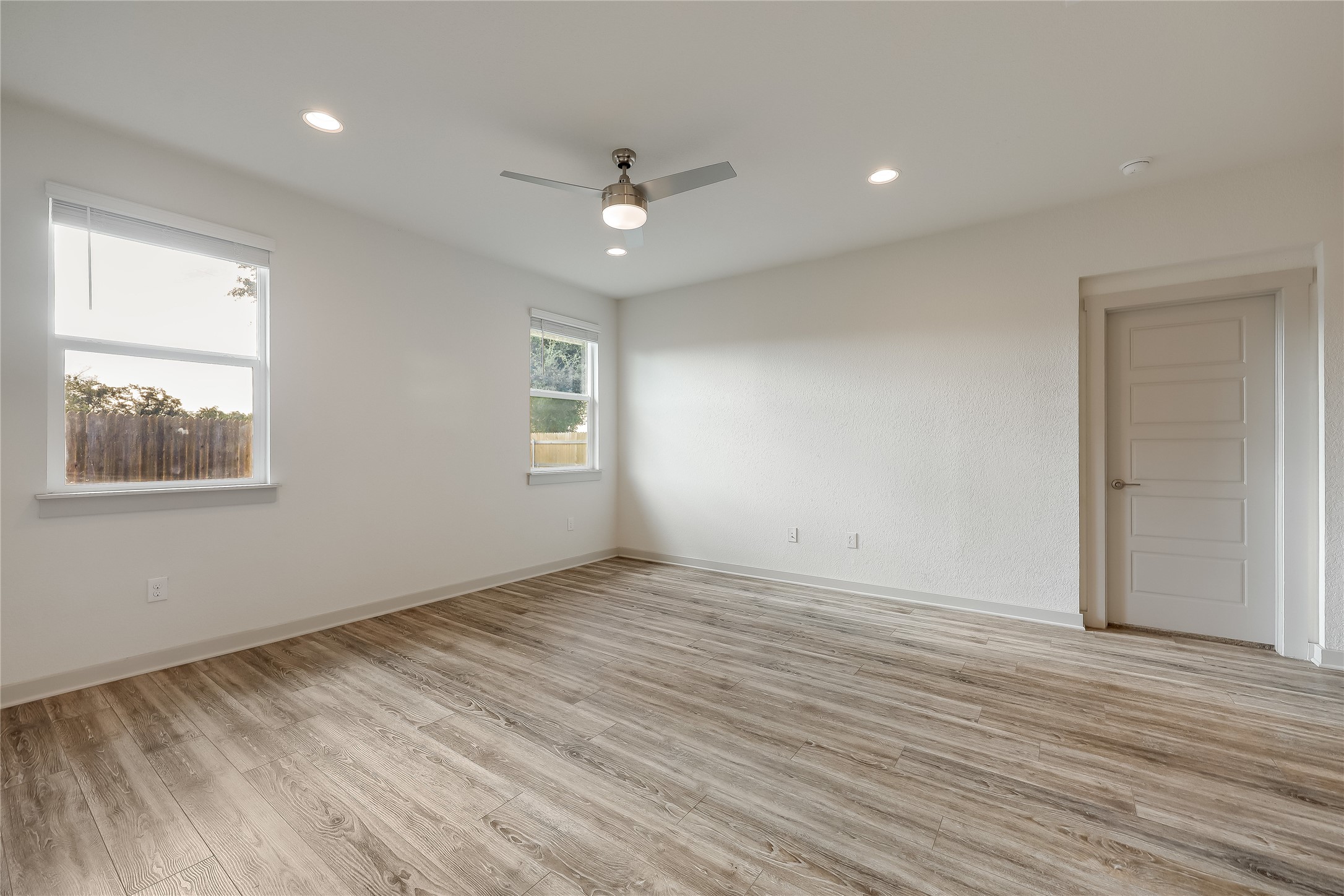 153 Filifera Court Leander, TX 78641 - Photo 17 of 33 a view of an empty room with wooden floor and a window