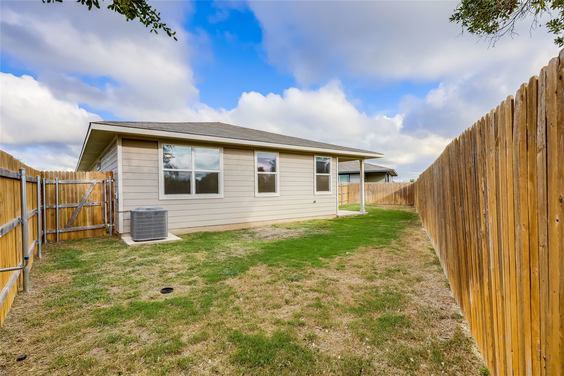 153 Filifera Court Leander, TX 78641 - Photo 32 of 33 a backyard of a house with lots of green space