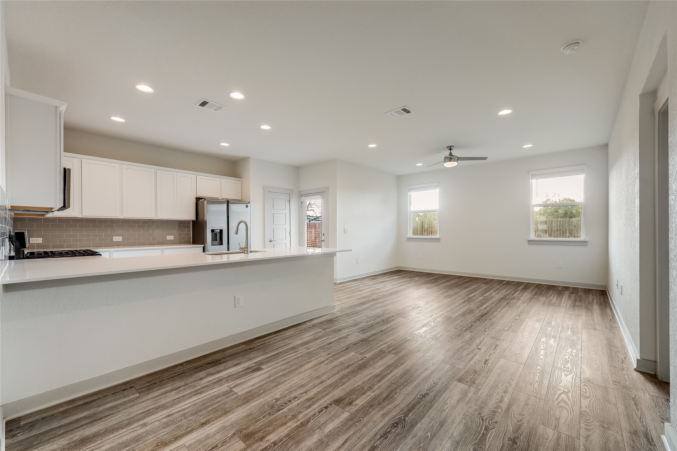 153 Filifera Court Leander, TX 78641 - Photo 7 of 33 a view of kitchen with wooden floor
