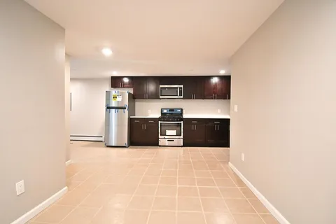 a kitchen with stainless steel appliances a sink and a microwave