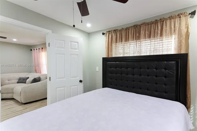 a bedroom with a bed and window