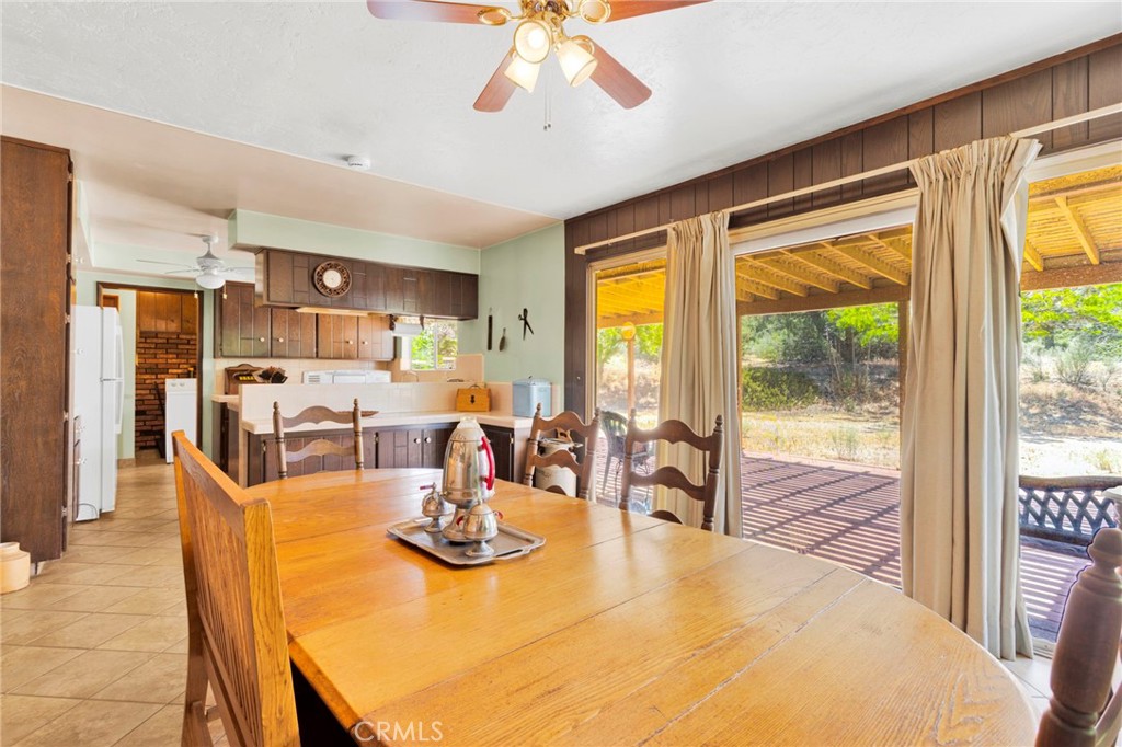 5500 Oil Well Road Phelan, CA 92371 - Photo 13 of 65 a view of a dining room with furniture window and outside view