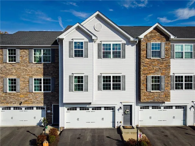 front view of a house with a street