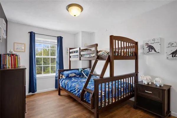 a bedroom with furniture and a window