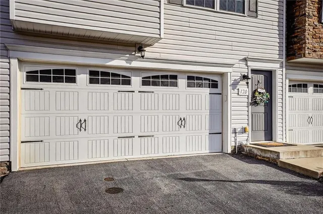 a front view of a house with a garage