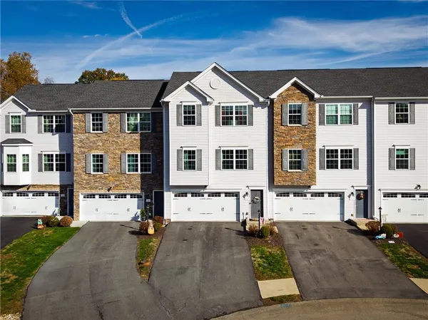 a view of multiple houses with a yard