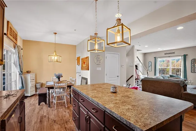 a kitchen with a table and chairs in it