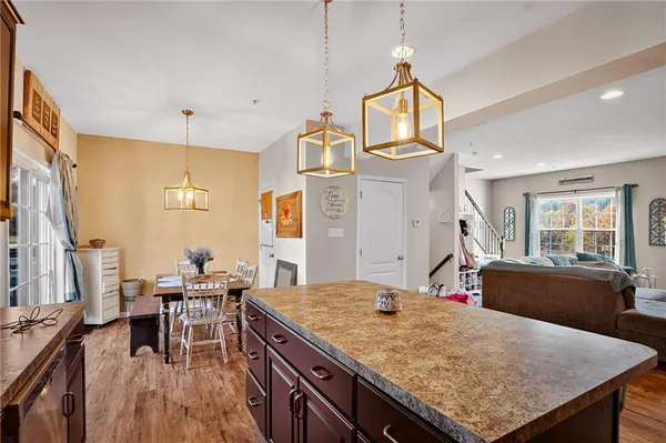 a kitchen with a table and chairs in it