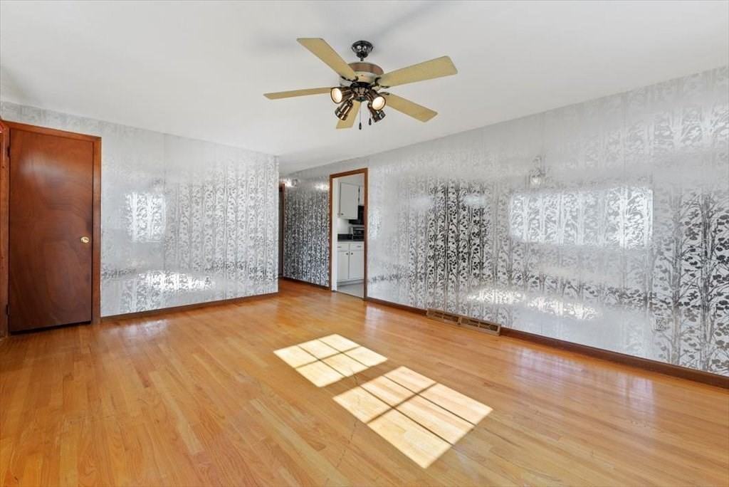 90 Fallston Street Springfield, MA 01119 - Photo 11 of 38 a view of empty room with wooden floor and fan