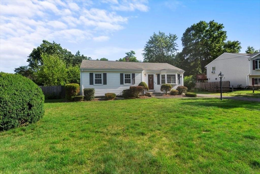 90 Fallston Street Springfield, MA 01119 - Photo 2 of 38 a front view of a house with a yard and green space