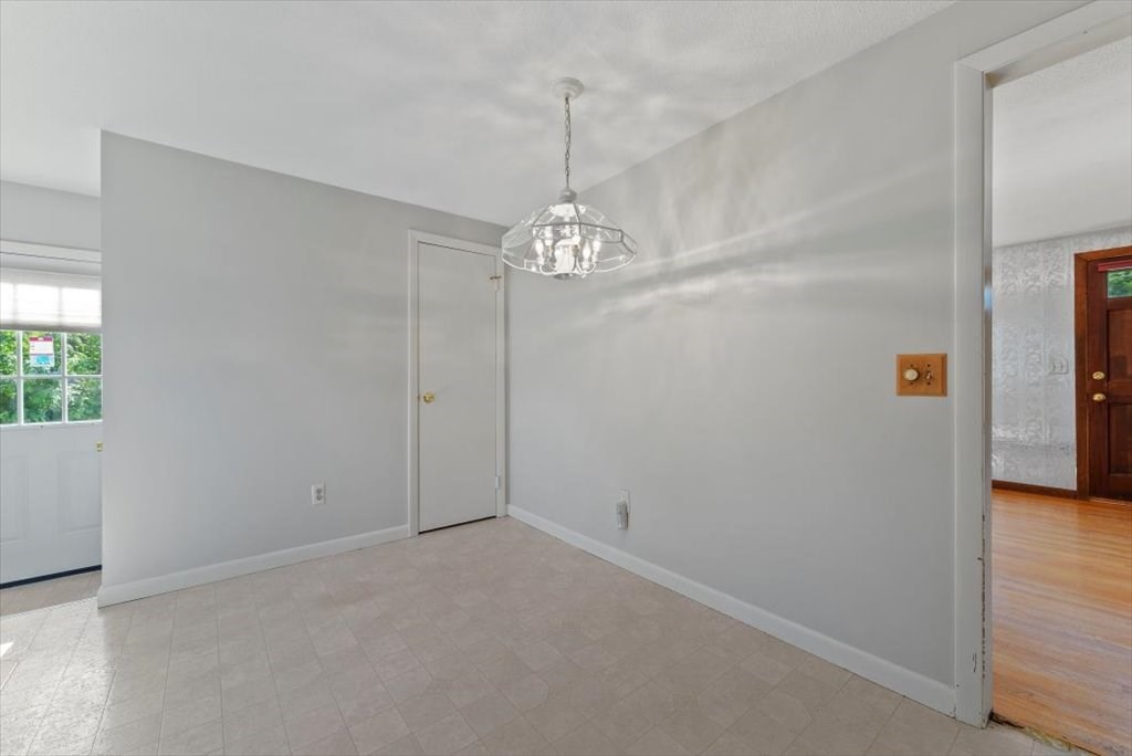 90 Fallston Street Springfield, MA 01119 - Photo 8 of 38 a view of a chandelier in big room and hallway