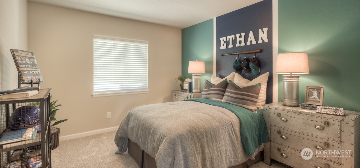 20926 42nd Drive Southeast, Unit 137 Bothell, WA 98021 - Photo 19 of 26 a bedroom with bed and a chair