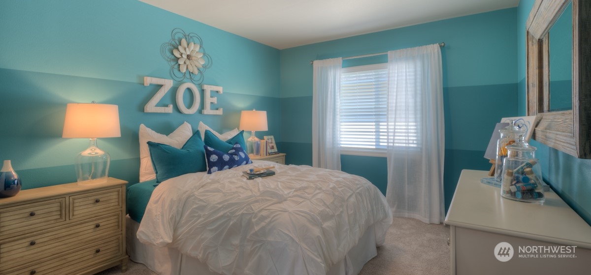 20926 42nd Drive Southeast, Unit 137 Bothell, WA 98021 - Photo 21 of 26 a bedroom with a bed and a dresser in it