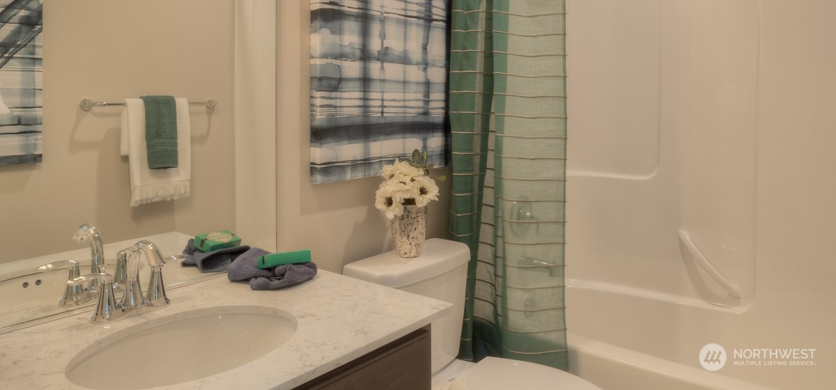 20926 42nd Drive Southeast, Unit 137 Bothell, WA 98021 - Photo 3 of 26 a bathroom with a sink toilet and shower