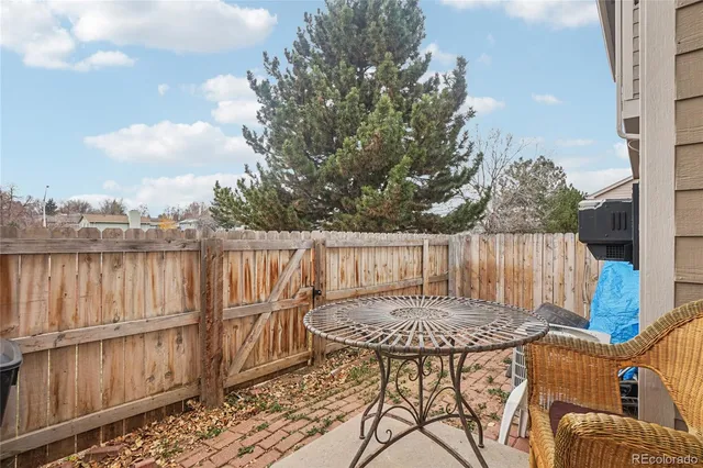 a view of balcony with furniture