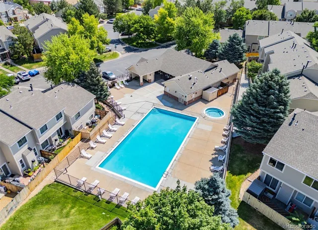 a view of street along with house and trees