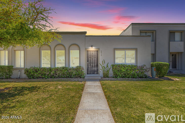 5913 East Thomas Road Scottsdale, AZ 85251 - Photo 3 of 26 a front view of a house with garden
