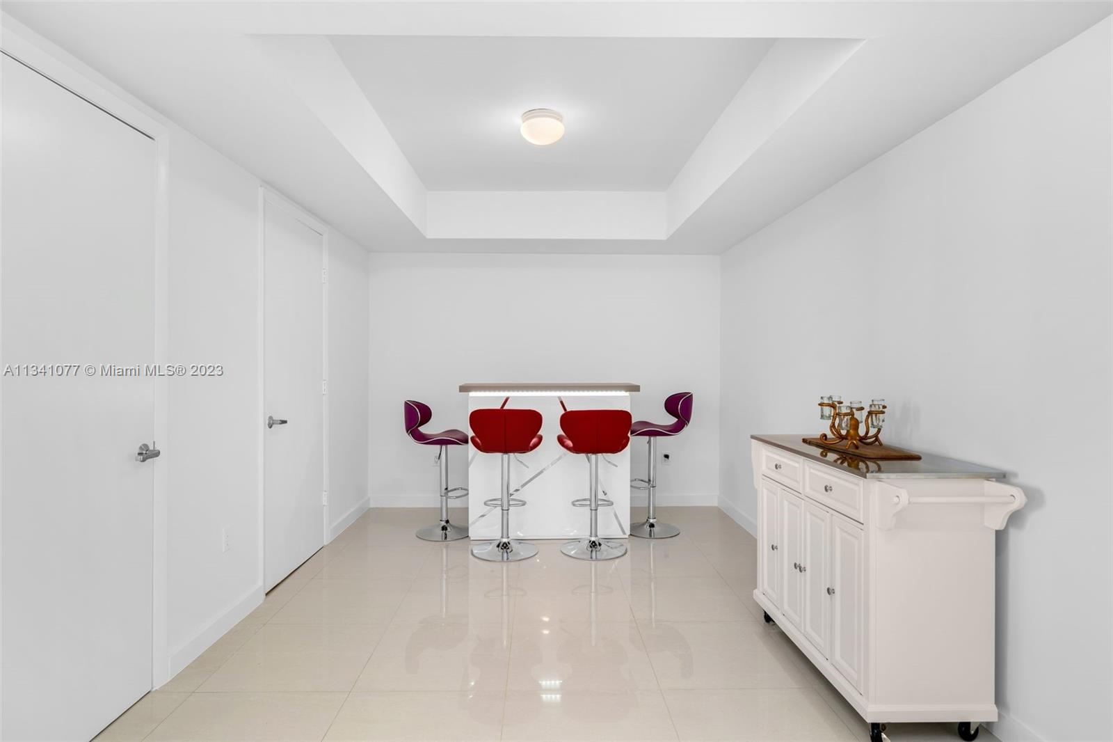 50 Biscayne Boulevard, Unit 3108 Miami, FL 33132 - Photo 3 of 26 a bathroom with a sink and a mirror