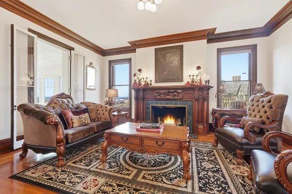 a living room with furniture and a fireplace