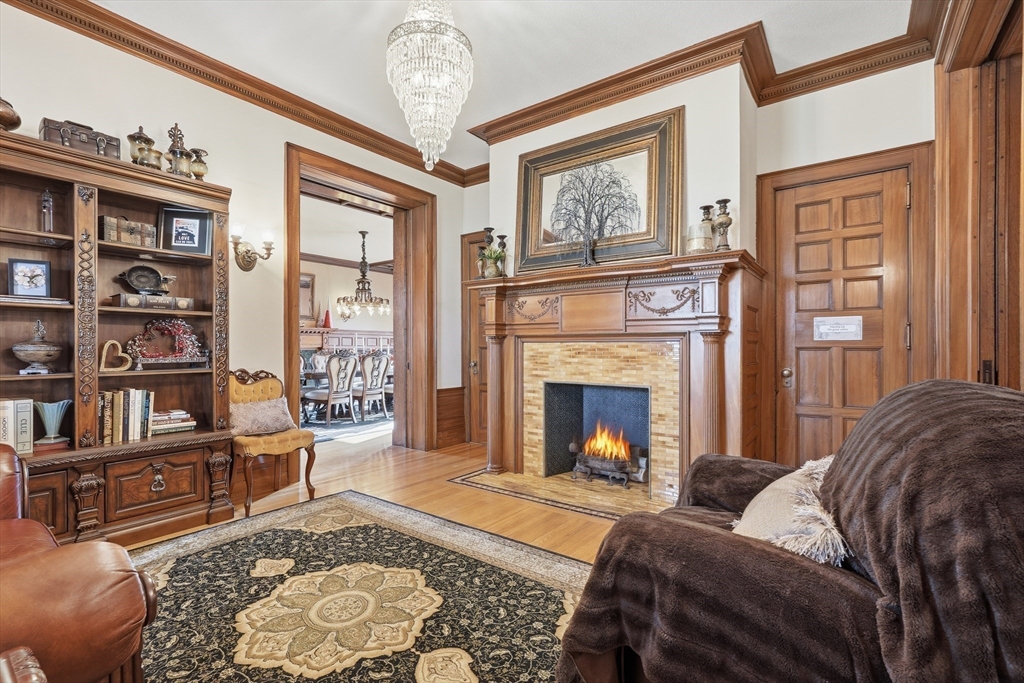 270 Maple Street Springfield, MA 01105 - Photo 12 of 42 a living room with furniture fireplace and a window