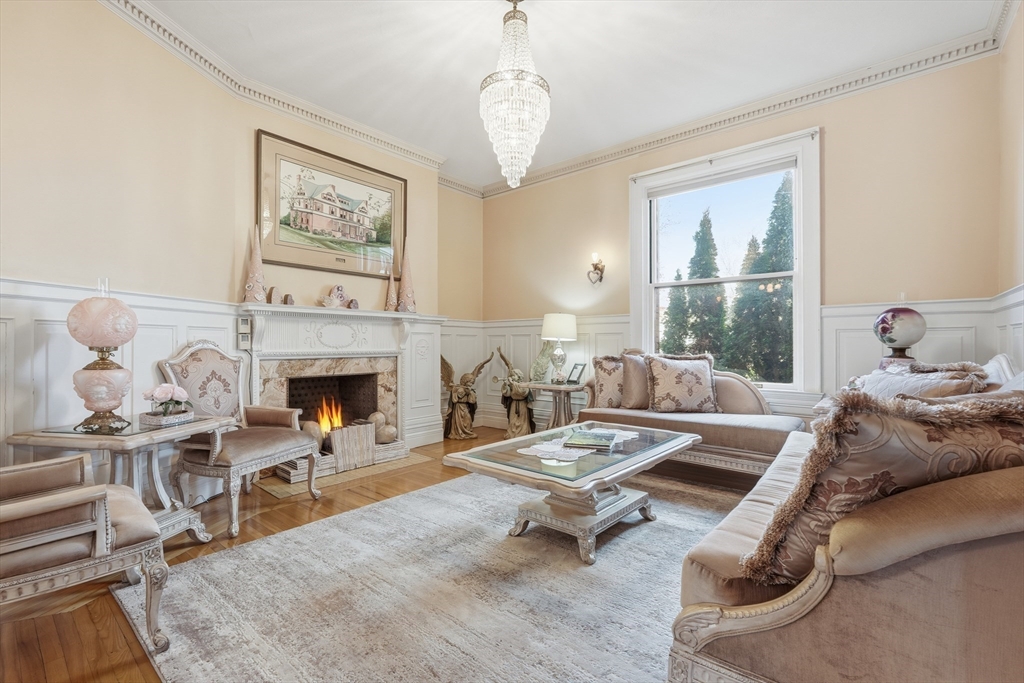 270 Maple Street Springfield, MA 01105 - Photo 13 of 42 a living room with furniture large window and a fireplace