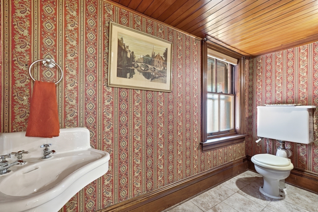 270 Maple Street Springfield, MA 01105 - Photo 17 of 42 a bathroom with a toilet sink and mirror