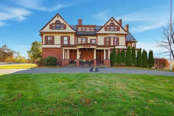 a front view of a house with a yard