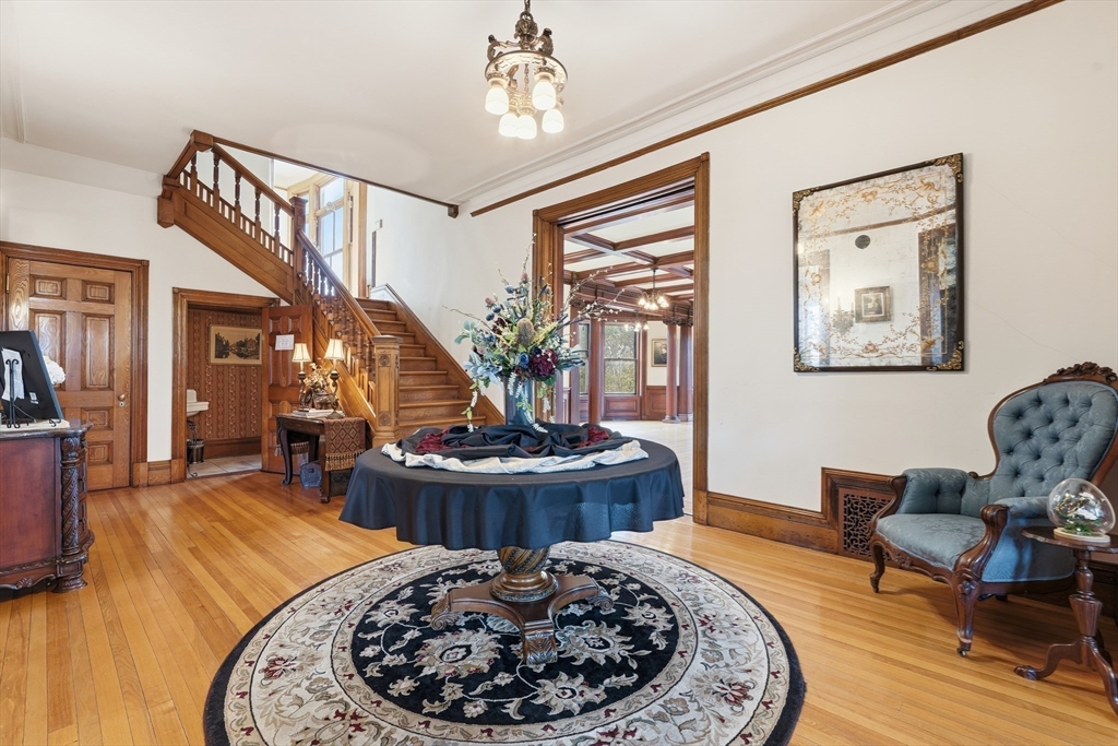270 Maple Street Springfield, MA 01105 - Photo 21 of 42 a living room with furniture and a fireplace