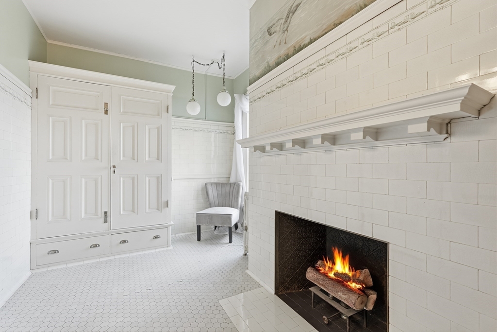 270 Maple Street Springfield, MA 01105 - Photo 28 of 42 a living room with furniture a flat screen tv and a fireplace