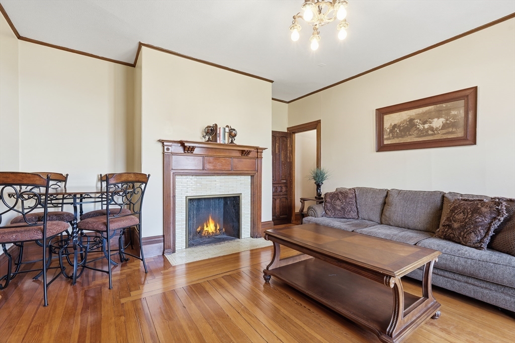 270 Maple Street Springfield, MA 01105 - Photo 29 of 42 a living room with furniture and a fireplace