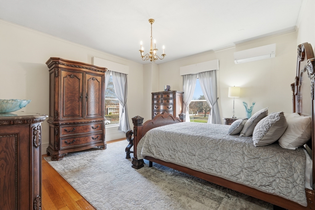 270 Maple Street Springfield, MA 01105 - Photo 33 of 42 a bedroom with a large bed and dresser