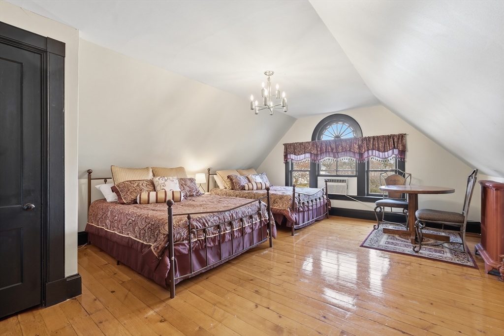 270 Maple Street Springfield, MA 01105 - Photo 36 of 42 a bed room with a bed window and a chair