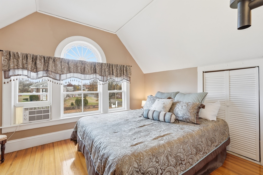 270 Maple Street Springfield, MA 01105 - Photo 37 of 42 a bedroom with a large bed and a large window