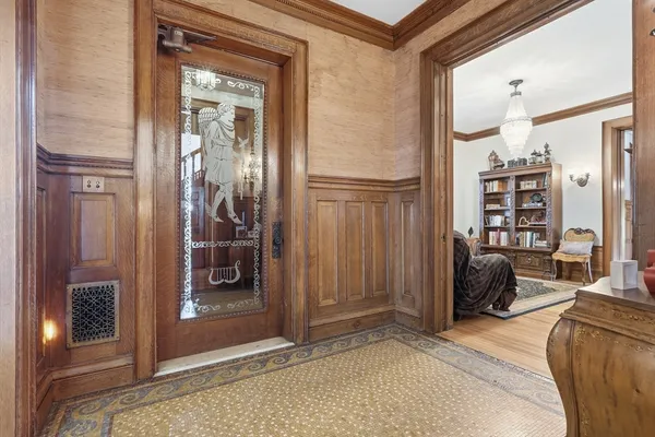 a bedroom with a bed and a mirror