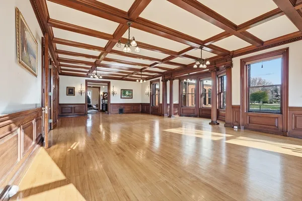 a view of an entryway with wooden floor