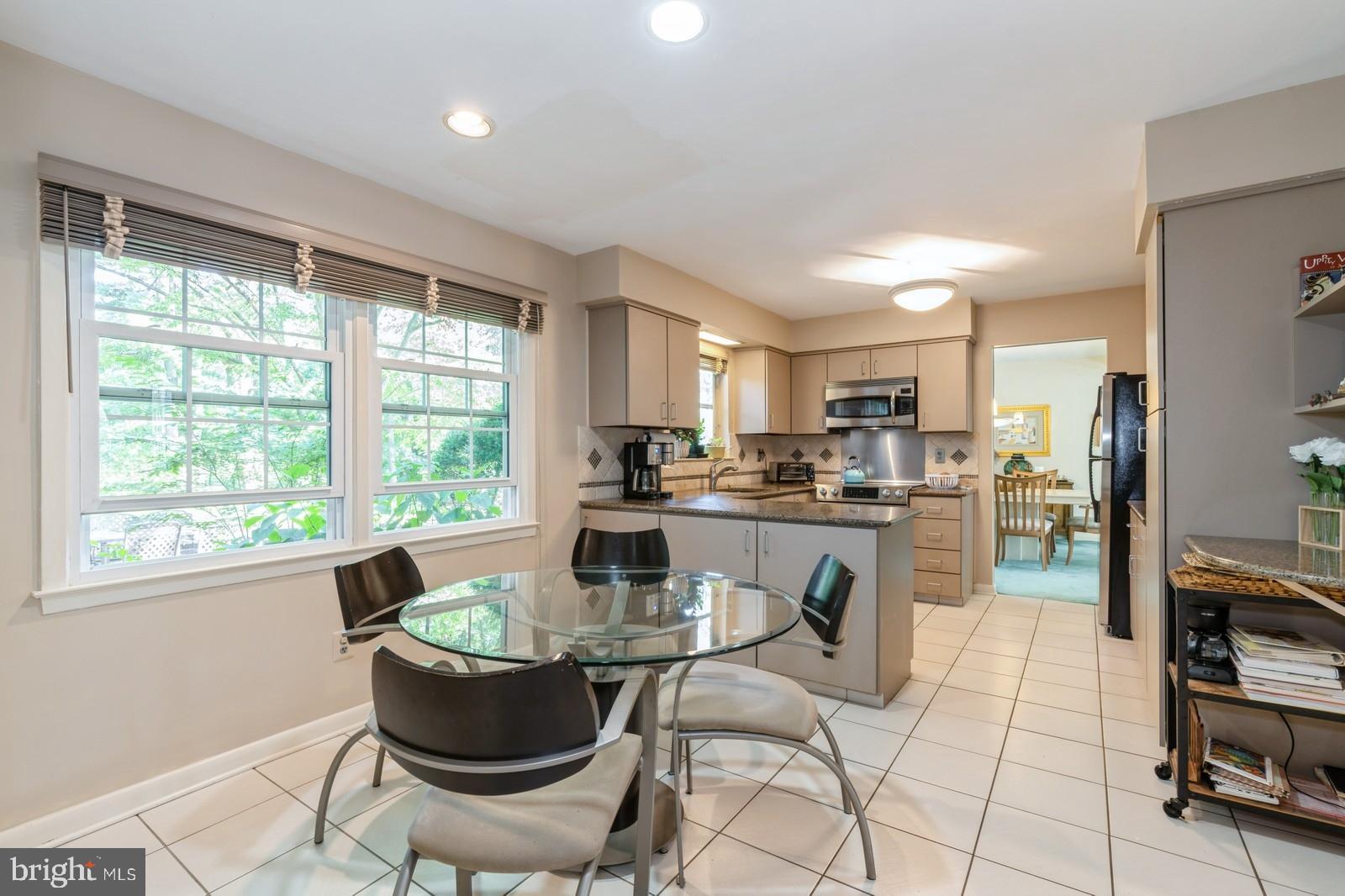 149 Parker Road South Plainsboro, NJ 08536 - Photo 28 of 57 a kitchen with a table and chairs