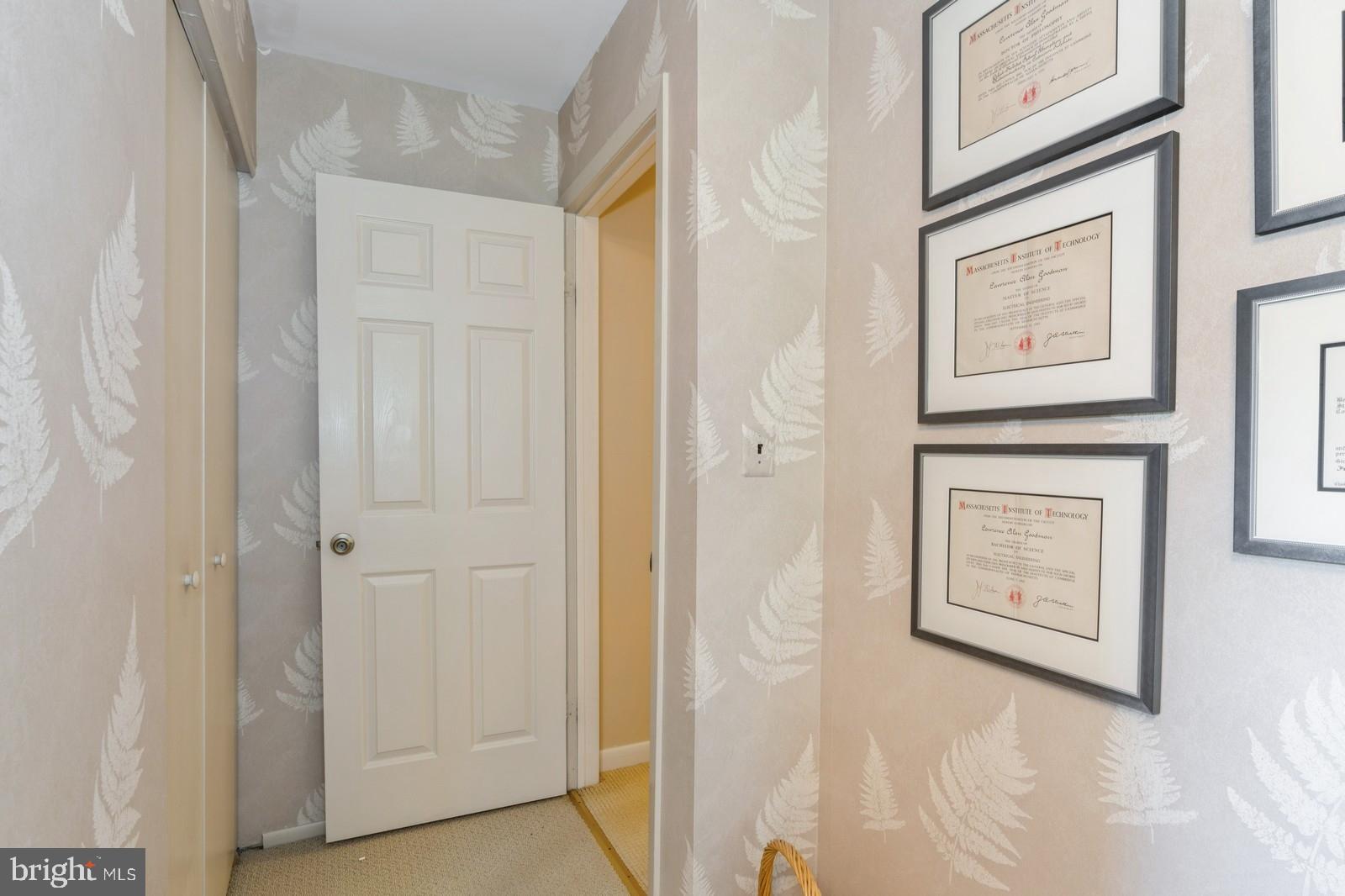 149 Parker Road South Plainsboro, NJ 08536 - Photo 48 of 57 a view of a hallway with paintings on the wall