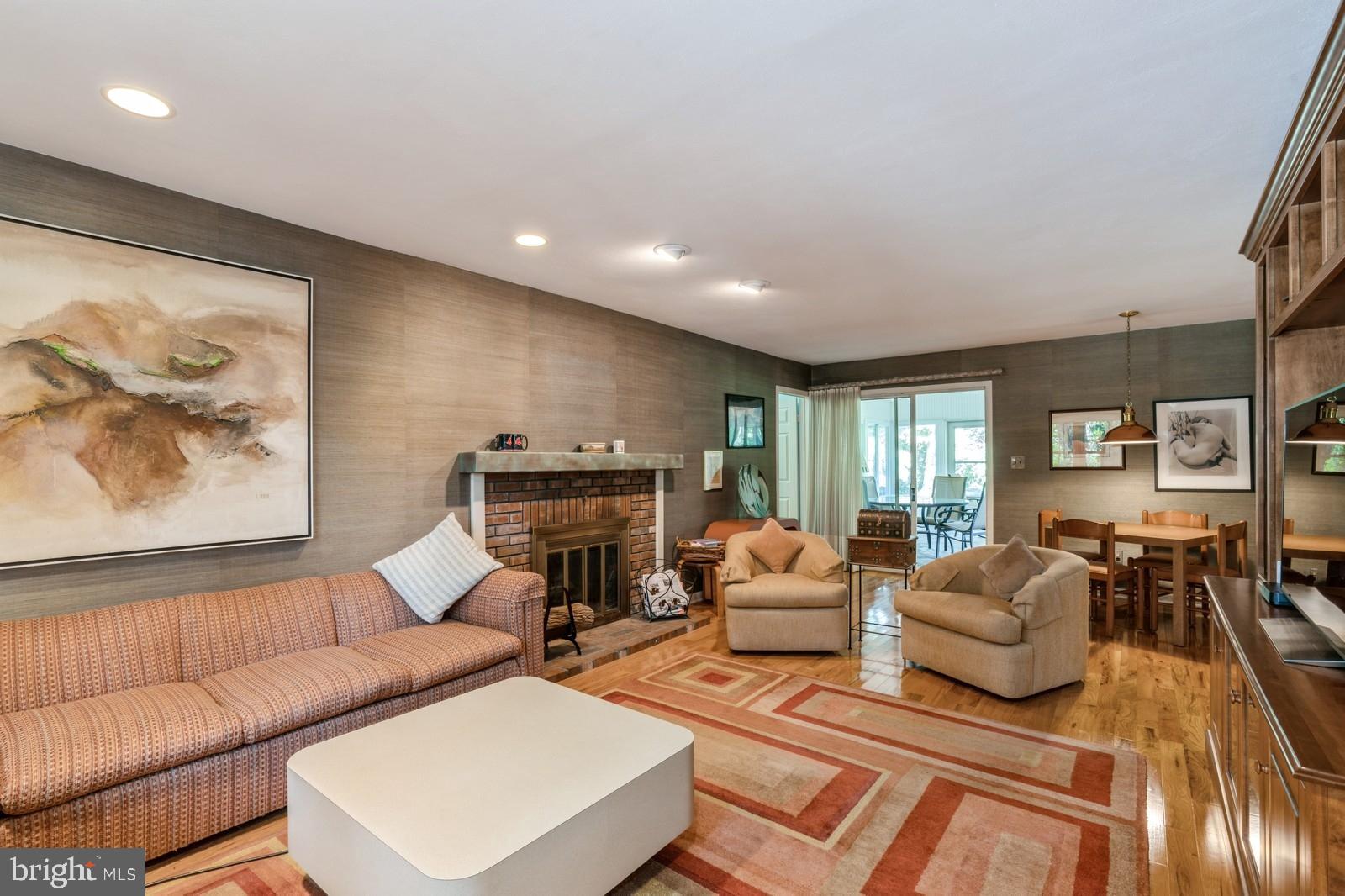 149 Parker Road South Plainsboro, NJ 08536 - Photo 7 of 57 a living room with furniture a fireplace and a flat screen tv