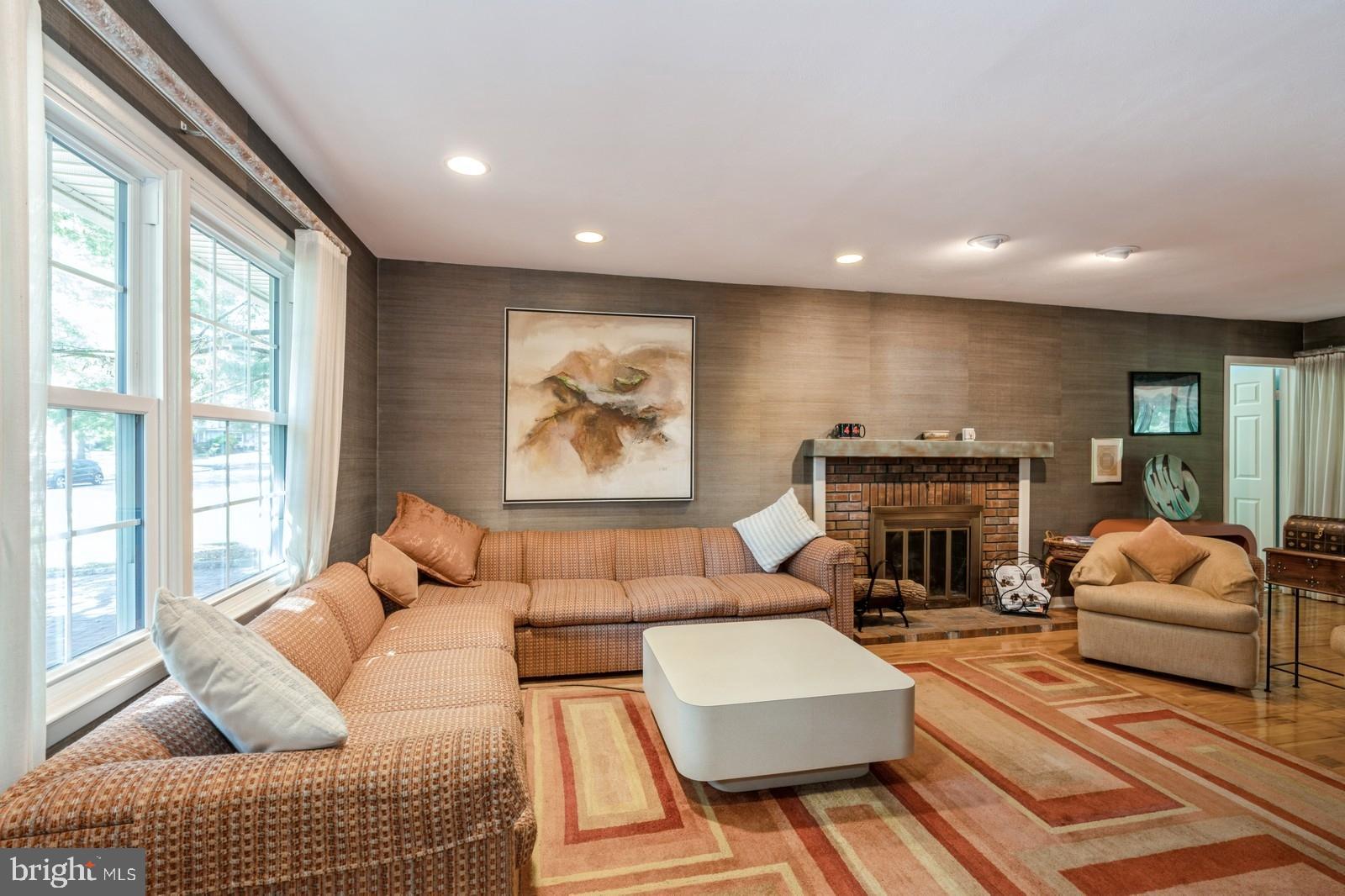149 Parker Road South Plainsboro, NJ 08536 - Photo 8 of 57 a living room with furniture fireplace and a large window