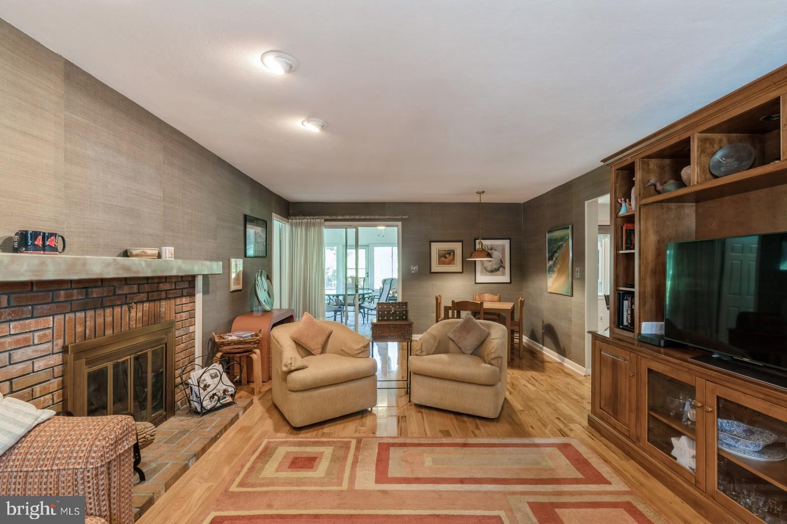149 Parker Road South Plainsboro, NJ 08536 - Photo 9 of 57 a living room with furniture a flat screen tv and a fireplace