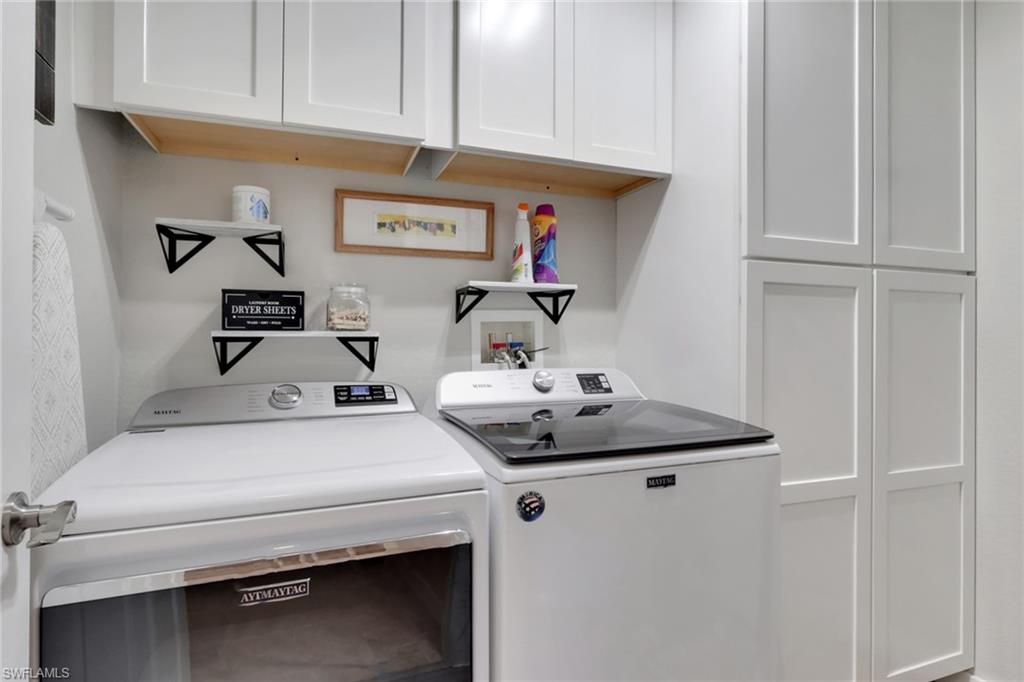 4500 Botanical Pl Circle, Unit 101 Naples, FL 34112 - Photo 26 of 44 a utility room with dryer and washer