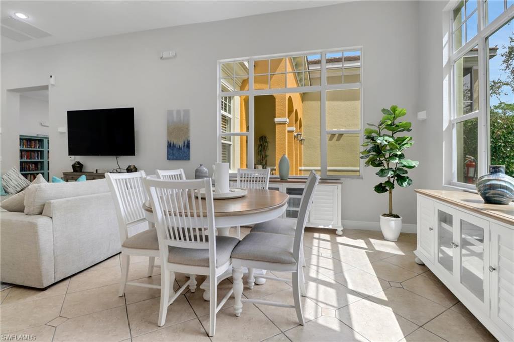 4500 Botanical Pl Circle, Unit 101 Naples, FL 34112 - Photo 35 of 44 a view of a livingroom with furniture and a flat screen tv