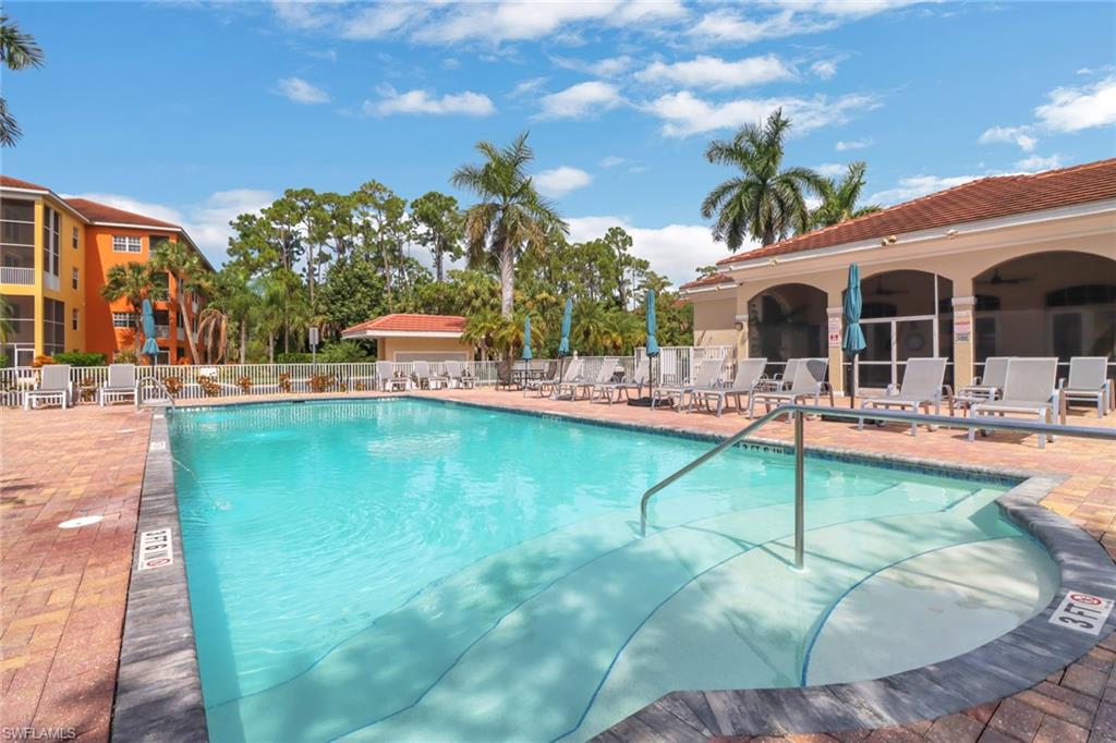 4500 Botanical Pl Circle, Unit 101 Naples, FL 34112 - Photo 40 of 44 a view of a house with swimming pool