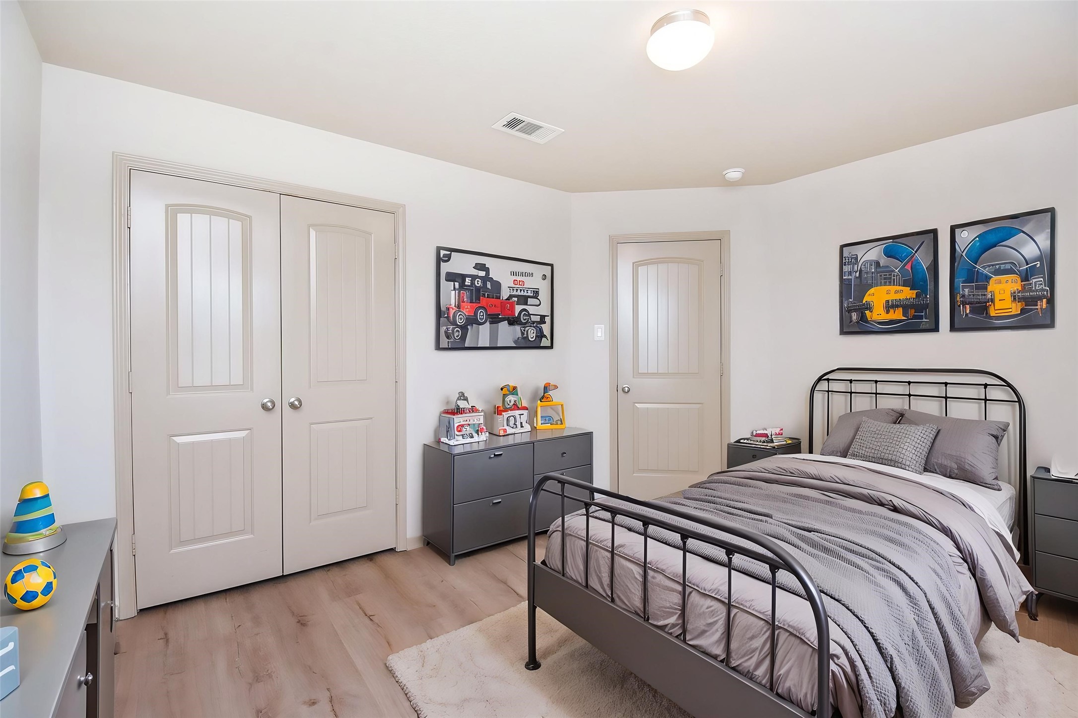 2106 Harmon Crest Court Spring, TX 77373 - Photo 34 of 37 a bedroom with a bed and painting on the wall
